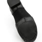 Bottom view of E-Series Jazz Slip On in Black, showing the sole and traction pads on a white background.