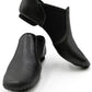 Front view of a pair of E-Series Jazz Slip On jazz shoes in Black, isolated on a white background.