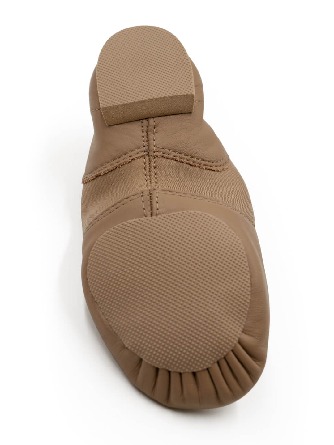 Bottom view of E-Series Jazz Slip On in Caramel, showing the sole and traction pads on a white background.
