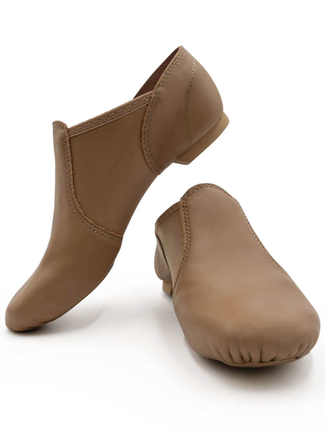 Front view of a pair of E-Series Jazz Slip On jazz shoes together in Caramel, isolated on a white background.