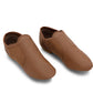 Side profile view of a pair of E-Series Jazz Slip On shoes together in Skintone 60 on a seamless white background.