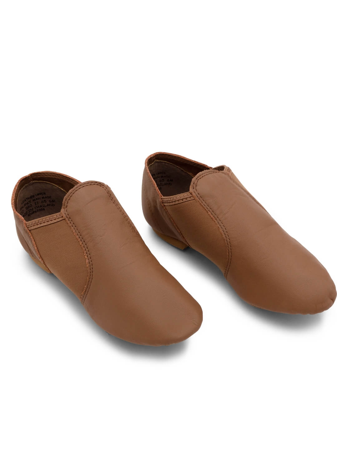 Side profile view of a pair of E-Series Jazz Slip On shoes together in Skintone 60 on a seamless white background.